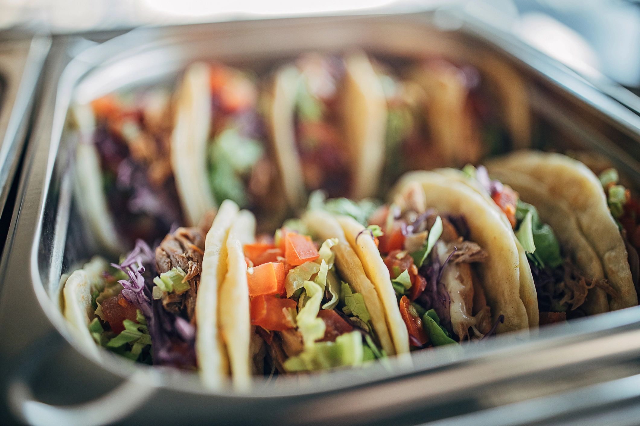 Close-up of beef tacos with fresh toppings
