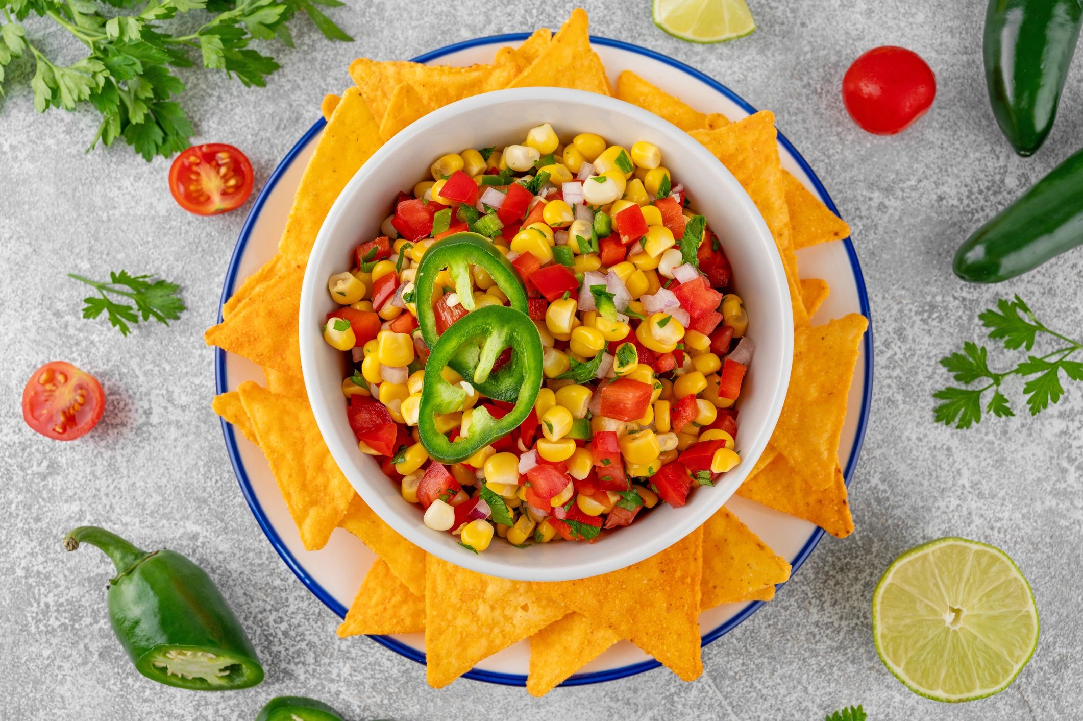 Corn salsa with lime, herbs, and tortilla chips